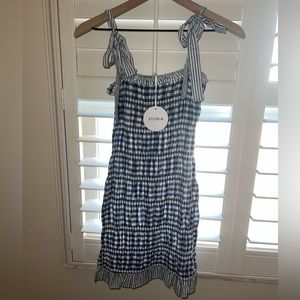 Smocked dress with adjustable tie string straps